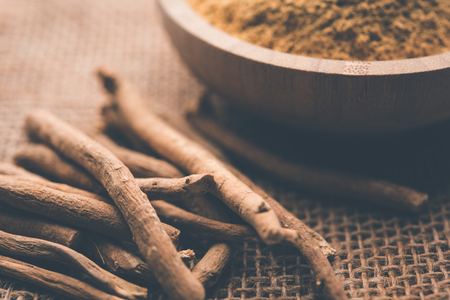 Ashwagandha / Aswaganda OR Indian Ginseng is an Ayurveda medicine in stem and powder form. Isolated on plain background. selective focusの写真素材