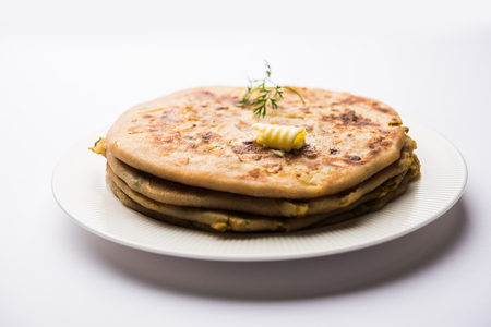 Aloo Paratha / Indian Potato stuffed Flatbread. Served with fresh curd and tomato ketchup. selective focusの写真素材