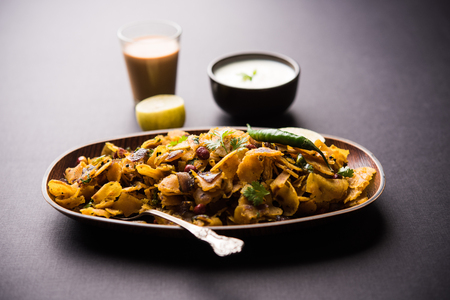 Homemade Kothu Parotta/ Paratha or Stir Fried Leftover Chapati Masala or  fodnichi poli in marathi, served in a bowl or plate with curd and hot tea. Selective focusの写真素材