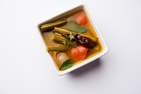 Drumstick Curry or Shevga sheng bhaji or south indian Sambar, served in a bowl over moody background. Selective focusの写真素材