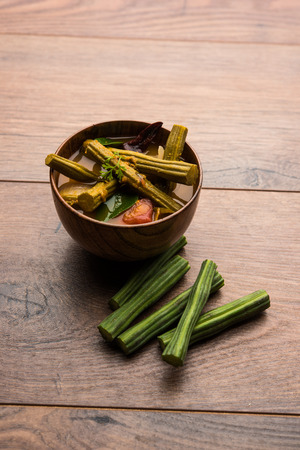 Drumstick Curry or Shevga sheng bhaji or south indian Sambar, served in a bowl over moody background. Selective focusの写真素材