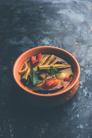 Drumstick Curry or Shevga sheng bhaji or south indian Sambar, served in a bowl over moody background. Selective focusの写真素材