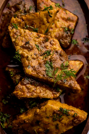 Patodi Rassa Bhaji or patwadi Sabji, a popular Maharashtrian spicy recipe served with Chapati and salad. Selective focusの写真素材