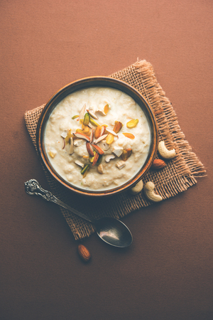 Sweet Rabdi or Lachha Rabri or basundi, made with pure milk garnished with dry fruits. Served in a bowl over moody background. Selective focusの写真素材