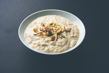 Sweet Rabdi or Lachha Rabri or basundi, made with pure milk garnished with dry fruits. Served in a bowl over moody background. Selective focusの写真素材