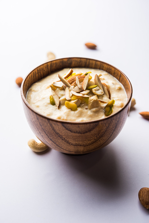 Sweet Rabdi or Lachha Rabri or basundi, made with pure milk garnished with dry fruits. Served in a bowl over moody background. Selective focusの写真素材