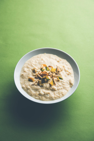 Sweet Rabdi or Lachha Rabri or basundi, made with pure milk garnished with dry fruits. Served in a bowl over moody background. Selective focusの写真素材