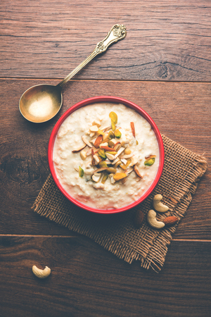 Sweet Rabdi or Lachha Rabri or basundi, made with pure milk garnished with dry fruits. Served in a bowl over moody background. Selective focusの写真素材