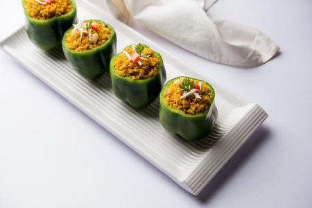 Stuffed capsicum or bharwa shimla mirchi is a popular Indian main course recipe.の写真素材