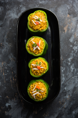 Stuffed capsicum or bharwa shimla mirchi is a popular Indian main course recipe.の写真素材