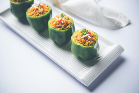 Stuffed capsicum or bharwa shimla mirchi is a popular Indian main course recipe.の写真素材