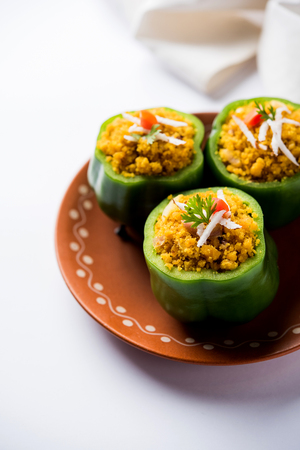 Stuffed capsicum or bharwa shimla mirchi is a popular Indian main course recipe.の写真素材