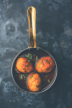 Fried egg curry or anda masala served in a bowl. selective focusの写真素材