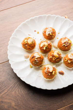 Carrot Halwa Laddu or sweet balls,  served in a plate with dry fruits toppings. selective focusの写真素材