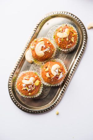 Carrot Halwa Laddu or sweet balls,  served in a plate with dry fruits toppings. selective focusの写真素材