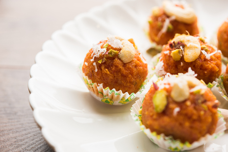 Carrot Halwa Laddu or sweet balls,  served in a plate with dry fruits toppings. selective focusの写真素材