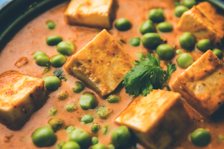 Green peas or matar paneer curry recipe, served in a bowl. selective focusの写真素材