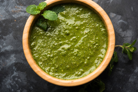 Healthy Green Mint Chutney Made with Coriander, pudina And Spices. isolated moody background. selective focusの写真素材