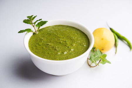 Healthy Green Mint Chutney Made with Coriander, pudina And Spices. isolated moody background. selective focusの写真素材