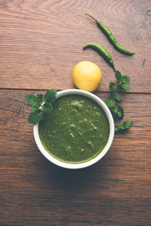 Healthy Green Mint Chutney Made with Coriander, pudina And Spices. isolated moody background. selective focusの写真素材