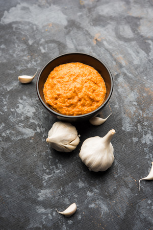 Garlic chutney, made using lahsun/lehsun originating from the India, served in a bowl over moody background. selective focusの写真素材