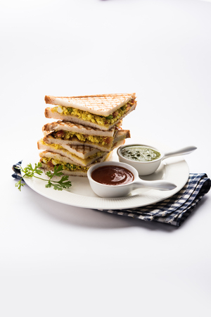 Paneer bhurji sandwich is a tasty paneer based dish made with cottage cheese.served with fresh tomato ketchup and green mint chutney. selective focusの写真素材