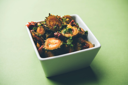 Cooked bitter Melon/gourd or Karela Sabzi served in a bowl. Scientific name of this healthy vegetable is Momordica charantia. selective focusの写真素材