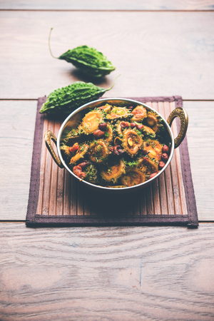 Cooked bitter Melon/gourd or Karela Sabzi served in a bowl. Scientific name of this healthy vegetable is Momordica charantia. selective focusの写真素材