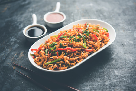 Crispy Noodles/maggie Pakora or pakoda is a popular indochinese street food served with ketchupの写真素材