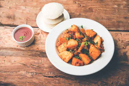 Masala fried Idlies or Idli fry - south indian Snack made using with leftover idly served with tomato ketchup. selective focusの写真素材