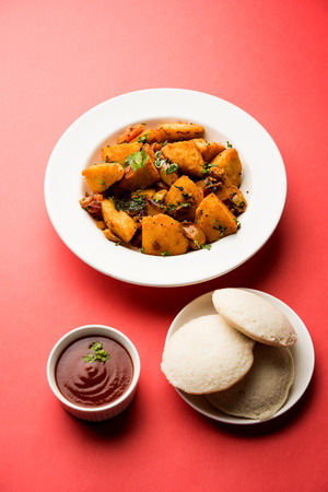 Masala fried Idlies or Idli fry - south indian Snack made using with leftover idly served with tomato ketchup. selective focusの写真素材