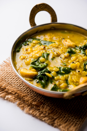 Dal Palak or Lentil spinach curry - popular Indian main course healthy recipe. served in a karahi/pan or bowl. selective focusの写真素材