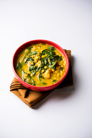 Dal Palak or Lentil spinach curry - popular Indian main course healthy recipe. served in a karahi/pan or bowl. selective focusの写真素材