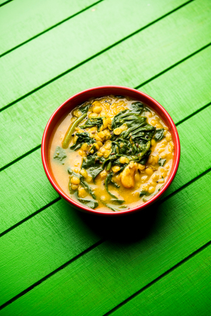 Dal Palak or Lentil spinach curry - popular Indian main course healthy recipe. served in a karahi/pan or bowl. selective focusの写真素材