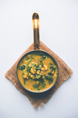 Dal Palak or Lentil spinach curry - popular Indian main course healthy recipe. served in a karahi/pan or bowl. selective focusの写真素材