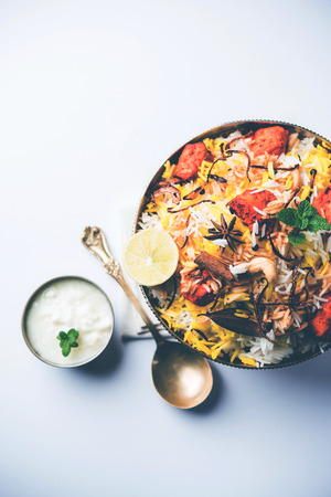 Indian Chicken Tikka Biriyani served in a bowl with yogurt. selective focusの写真素材