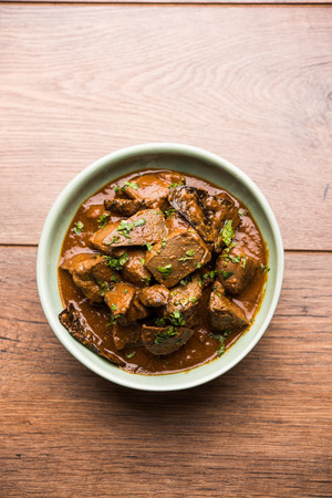 Mutton Liver fry or Kaleji masala, popular Non vegetarian recipe from India and Pakistan. served dry or with curry in a bowl, karahi or plateの写真素材