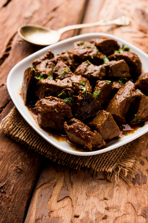 Mutton Liver fry or Kaleji masala, popular Non vegetarian recipe from India and Pakistan. served dry or with curry in a bowl, karahi or plateの写真素材