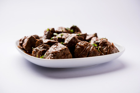 Mutton Liver fry or Kaleji masala, popular Non vegetarian recipe from India and Pakistan. served dry or with curry in a bowl, karahi or plateの写真素材