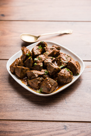 Mutton Liver fry or Kaleji masala, popular Non vegetarian recipe from India and Pakistan. served dry or with curry in a bowl, karahi or plateの写真素材