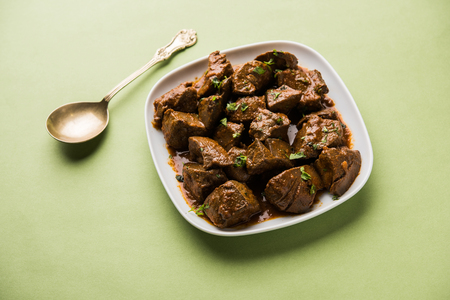 Mutton Liver fry or Kaleji masala, popular Non vegetarian recipe from India and Pakistan. served dry or with curry in a bowl, karahi or plateの写真素材
