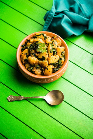 Fenugreek potato sabzi or Aloo Methi masala is healthy Indian Cuisine. served in a bowl or karahi. selective focusの写真素材