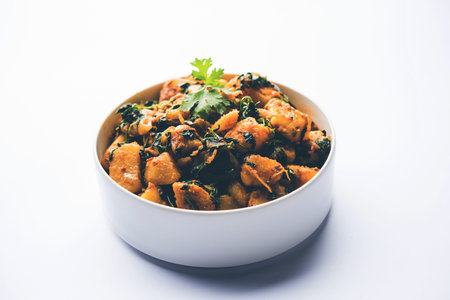 Fenugreek potato sabzi or Aloo Methi masala is healthy Indian Cuisine. served in a bowl or karahi....