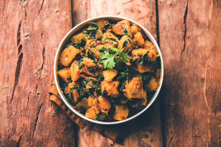 Fenugreek potato sabzi or Aloo Methi masala is healthy Indian Cuisine. served in a bowl or karahi. selective focusの写真素材