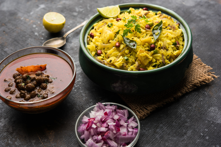 Aloo/Kanda Poha or Tarri Pohe with spicy chana masala/curry. selective focusの写真素材