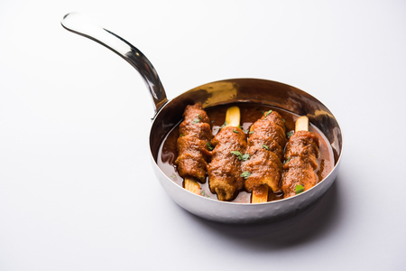 Baingan masala / Eggplant / brinjal curry served with chapati and rice, selective focusの写真素材