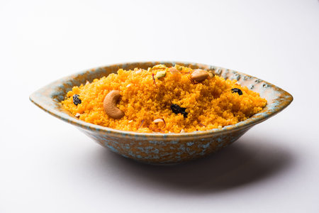Badaam kesar shira / Sheera or almond saffron halwa, popular Indian dessert served in a bowl....