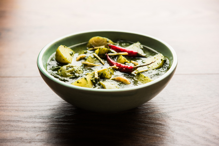 Aloo Palak sabzi or Spinach Potatoes curry served in a bowl. Popular Indian healthy recipe. Selective focusの写真素材