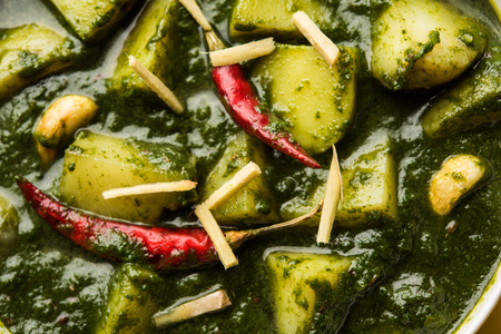 Aloo Palak sabzi or Spinach Potatoes curry served in a bowl. Popular Indian healthy recipe. Selective focusの写真素材