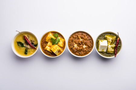 Palak paneer butter masala, yellow dal or dal-makhani served in a bowl in a group. selective focusの写真素材